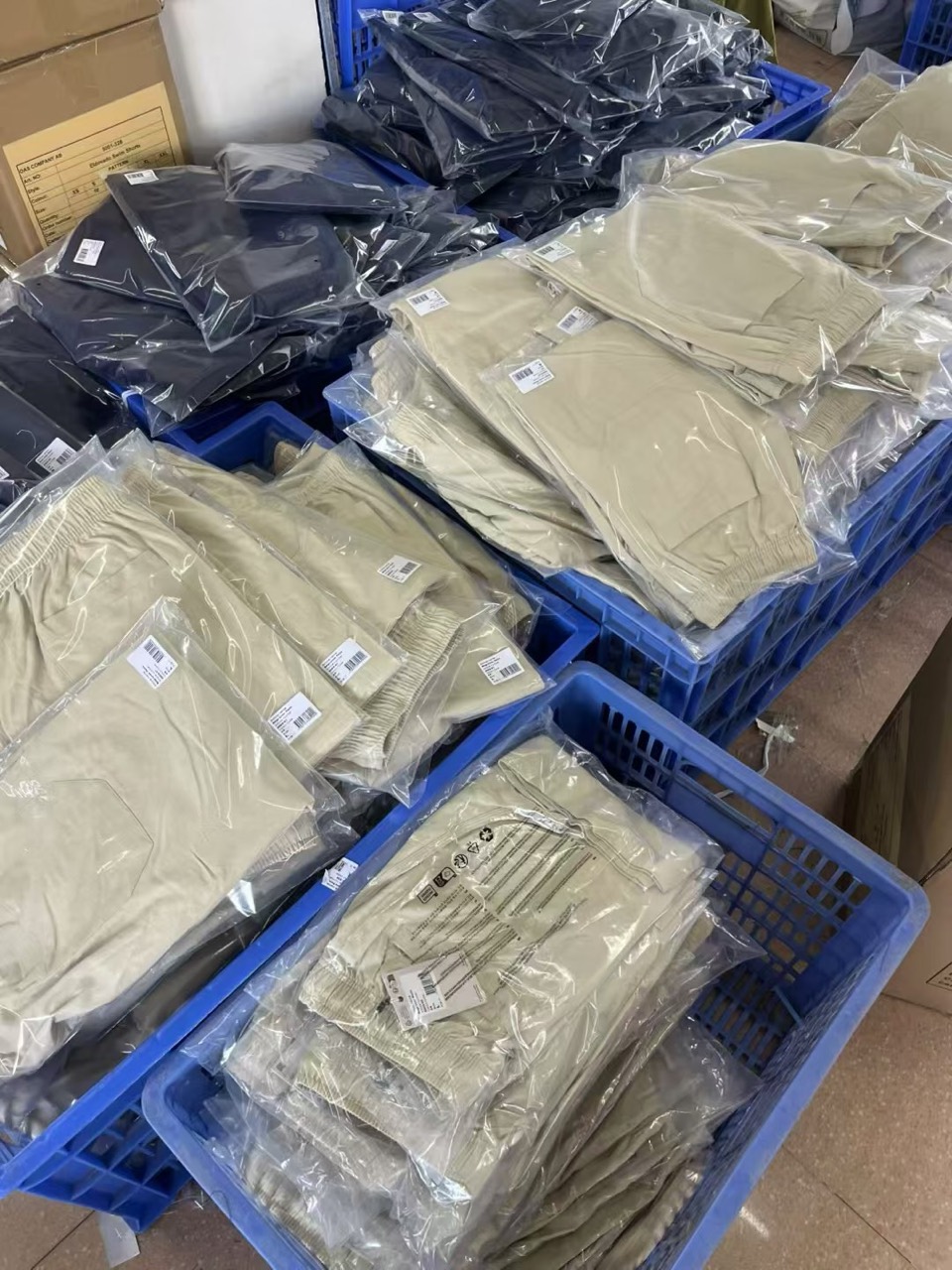 Individually packed garments organized for an export production program