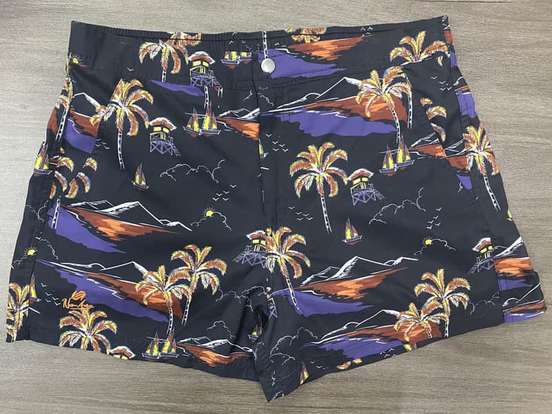 Front view of self-owned dark night-coast print elastic-waist swim shorts