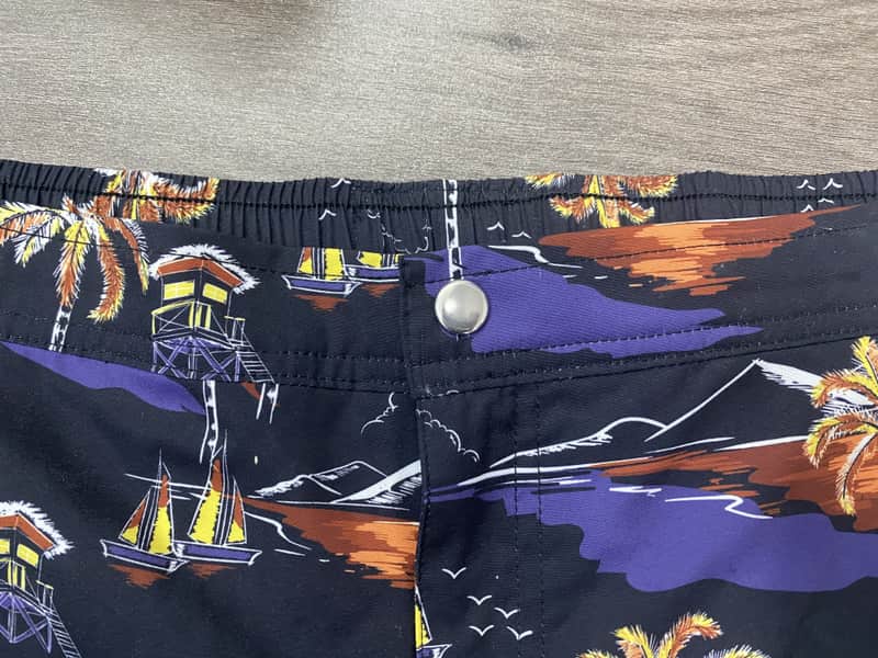 Elastic waistband and fly detail on night-coast print swim shorts